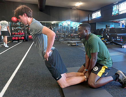 A young athlete with Coach Leo